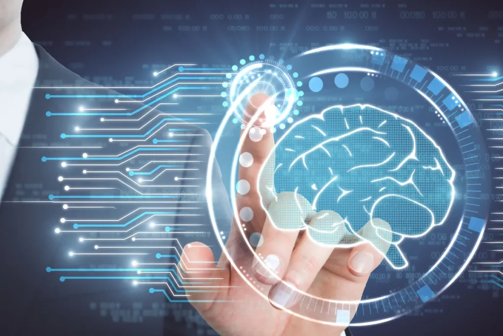 Mão humana interagindo com interface digital em formato de cérebro, simbolizando análise de dados com inteligência artificial